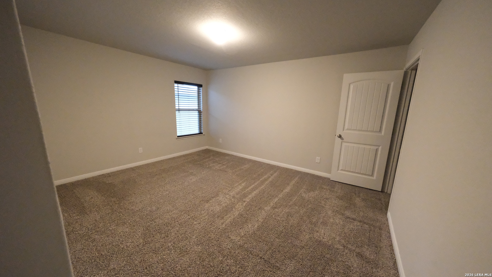 10335 Midsummer Converse, TX 78109 - Photo 17 of 24 an empty room with windows