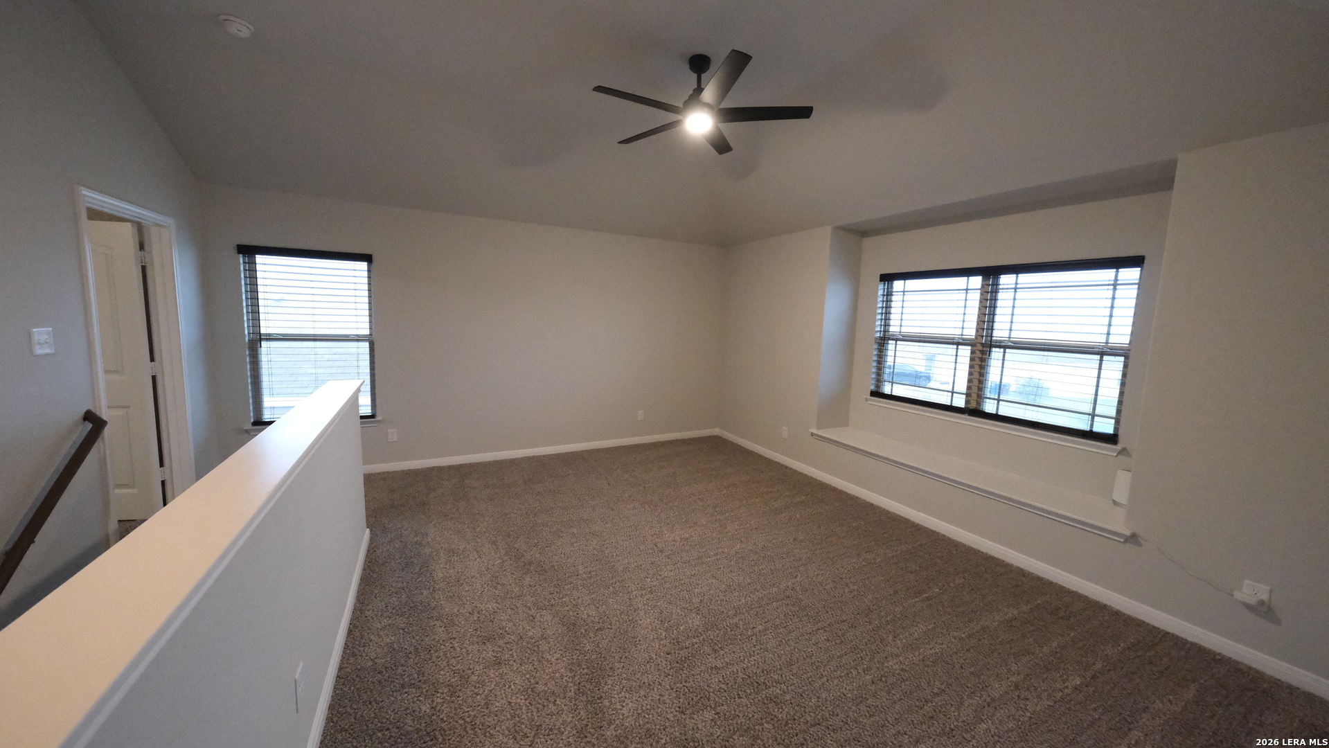 10335 Midsummer Converse, TX 78109 - Photo 6 of 24 wooden floor in an empty room with a window