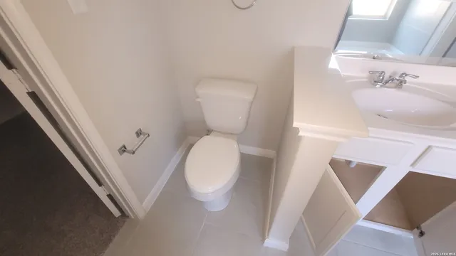 a bathroom with a sink and toilet