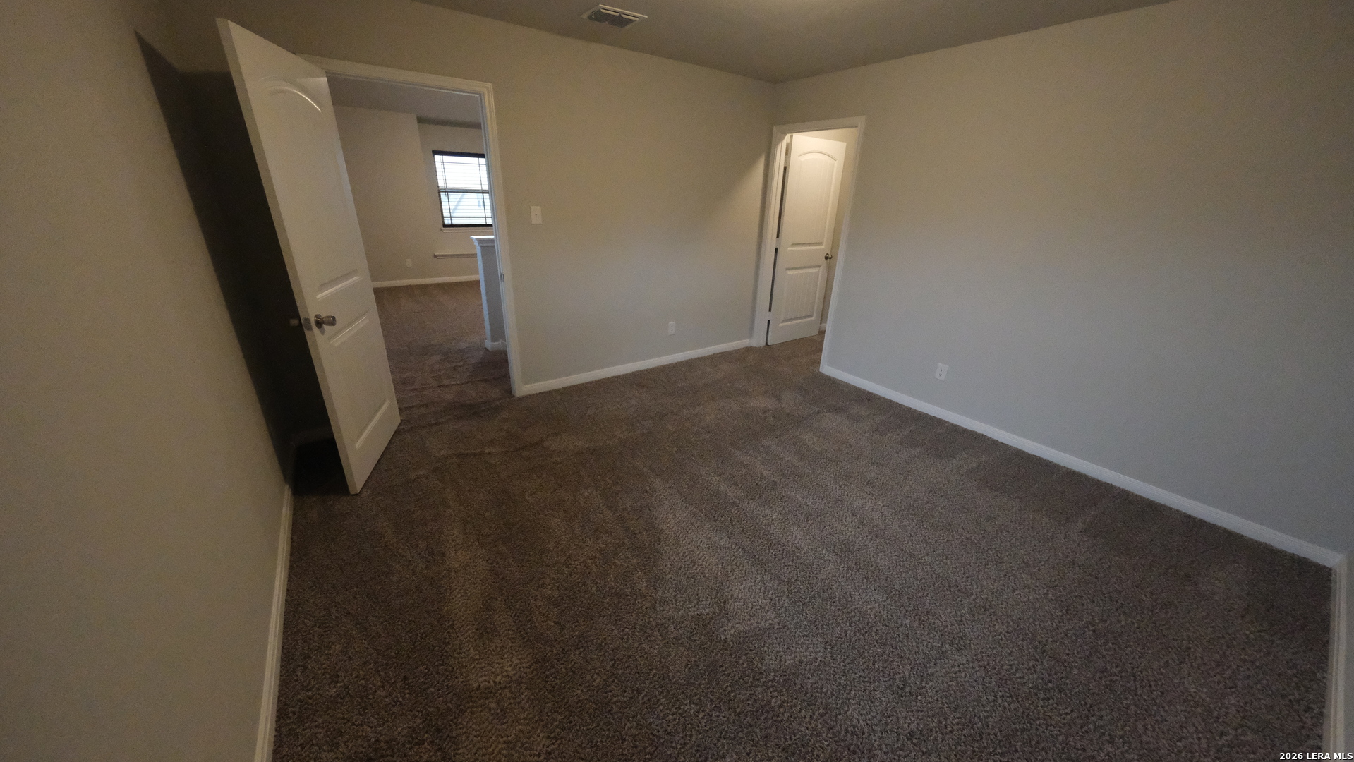 10335 Midsummer Converse, TX 78109 - Photo 9 of 24 an empty room with windows