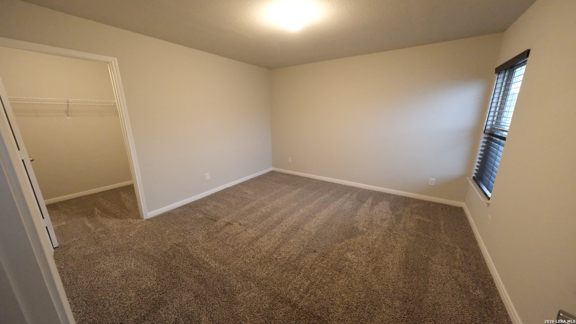 10335 Midsummer Converse, TX 78109 - Photo 10 of 24 an empty room with windows