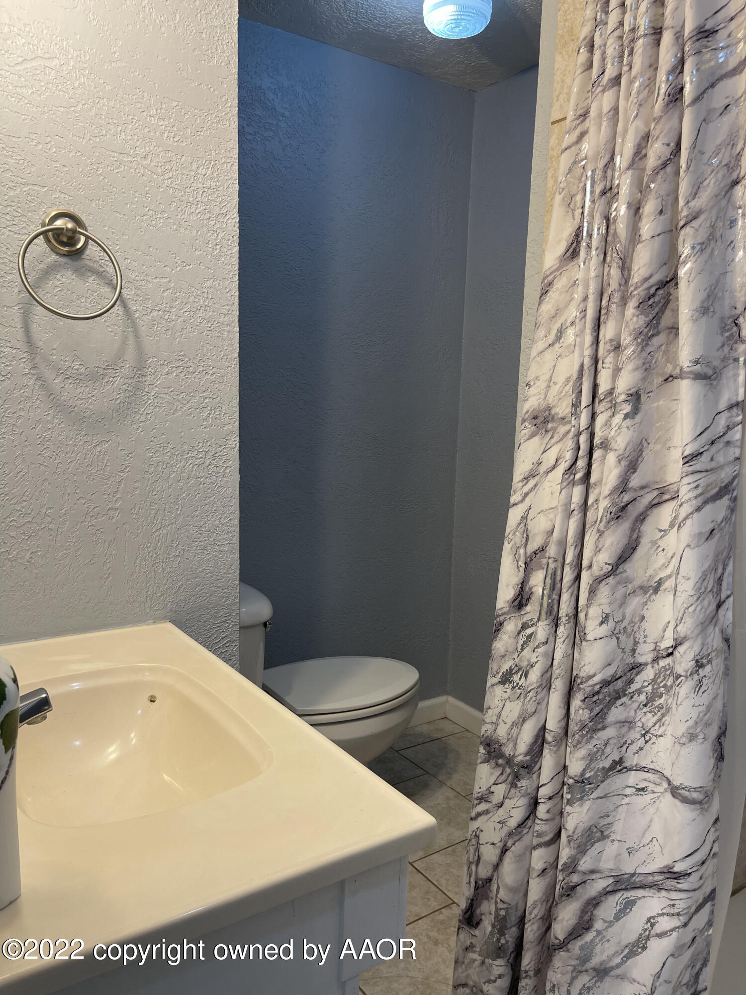 810 Ave Q Sunray, TX 79086 - Photo 22 of 29 a bathroom with a sink and a toilet