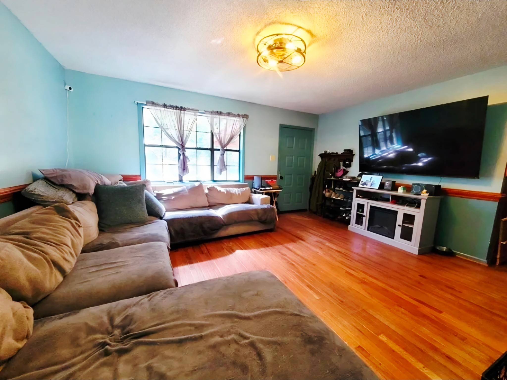 1360 Camden Bay Road Camden, TN 38320 - Photo 11 of 43 a living room with furniture and a flat screen tv
