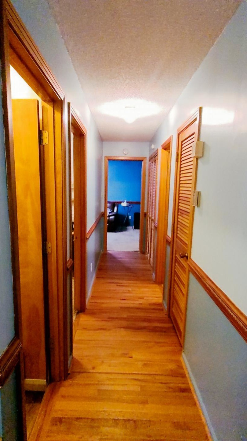 1360 Camden Bay Road Camden, TN 38320 - Photo 15 of 43 a view of a room with wooden floor and chair