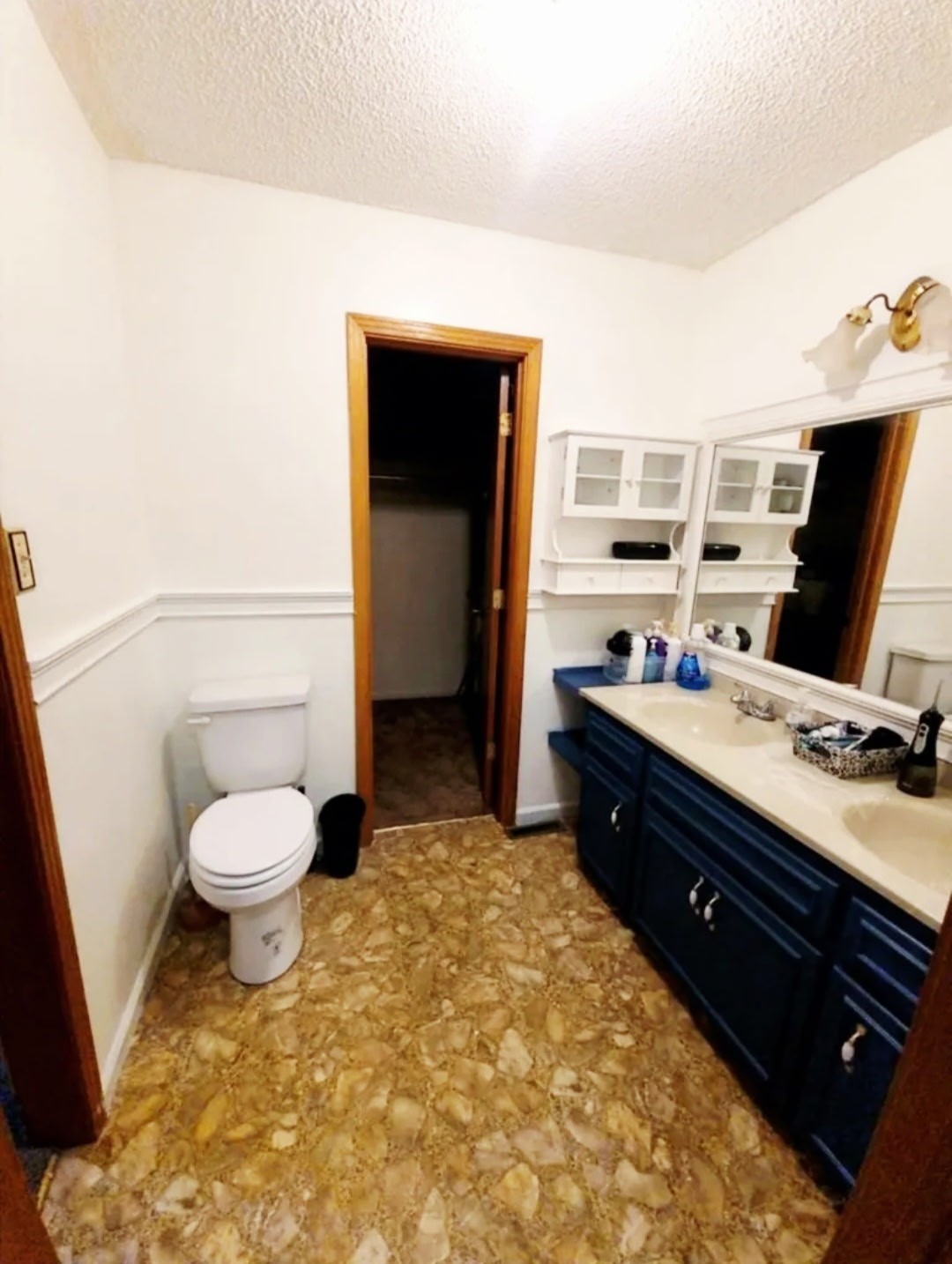 1360 Camden Bay Road Camden, TN 38320 - Photo 20 of 43 a spacious bathroom with a toilet sink and mirror