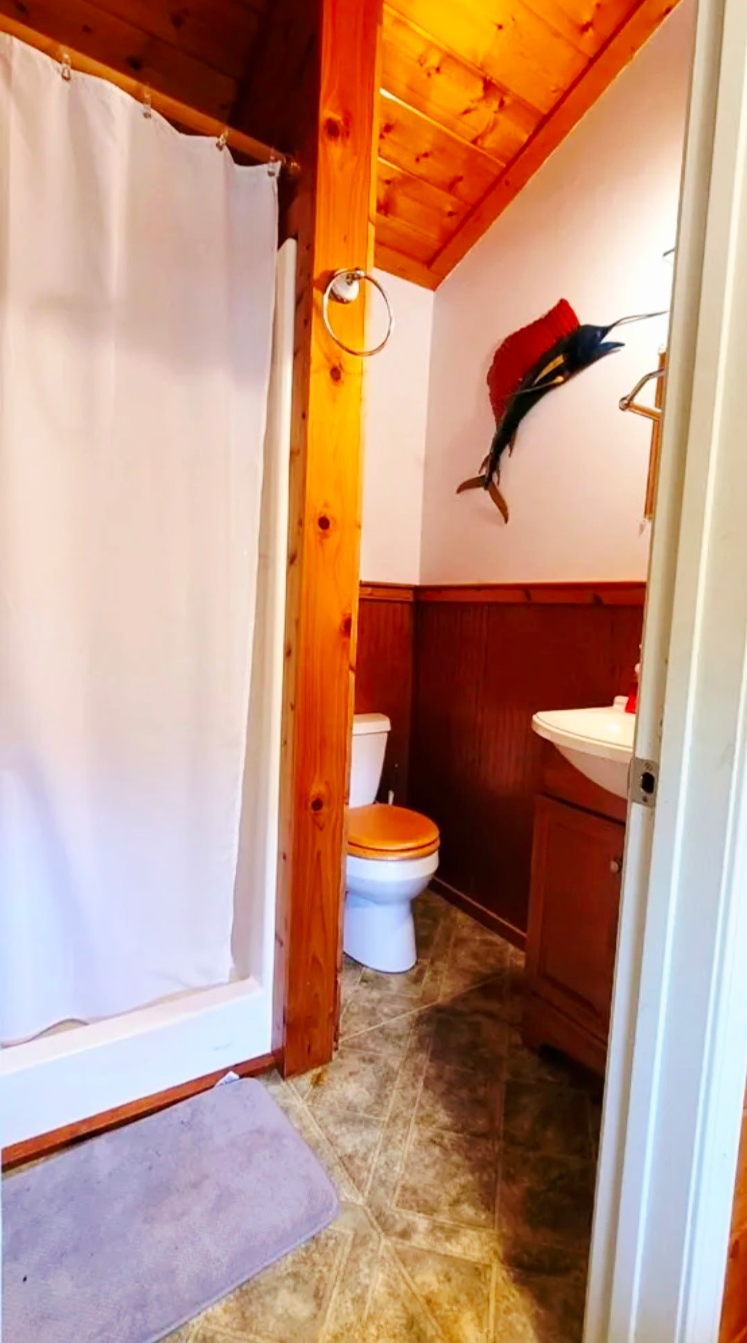 1360 Camden Bay Road Camden, TN 38320 - Photo 40 of 43 a bathroom with a toilet and a shower curtain