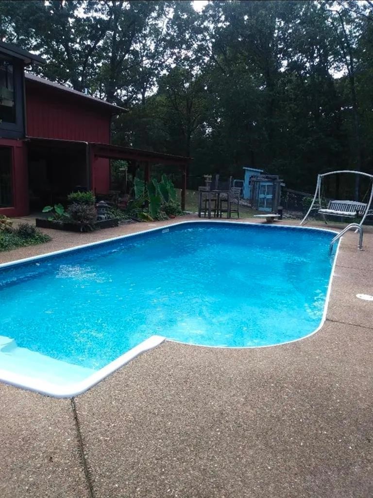 1360 Camden Bay Road Camden, TN 38320 - Photo 7 of 43 a view of a swimming pool with a patio