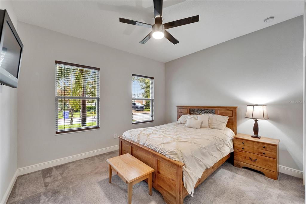 6127 Colmar Place Apollo Beach, FL 33572 - Photo 14 of 72 a bedroom with a bed dresser and a window