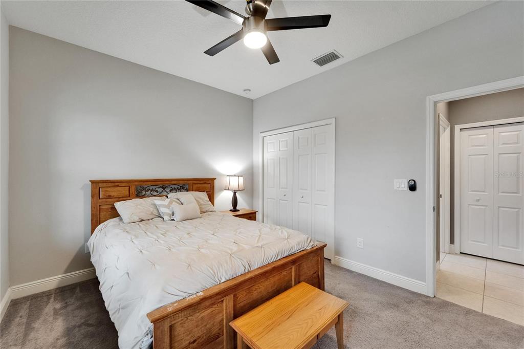 6127 Colmar Place Apollo Beach, FL 33572 - Photo 15 of 72 a bedroom with a bed and a window