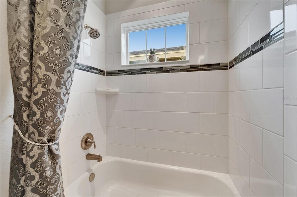 6127 Colmar Place Apollo Beach, FL 33572 - Photo 19 of 72 a bathroom with a bathtub and shower