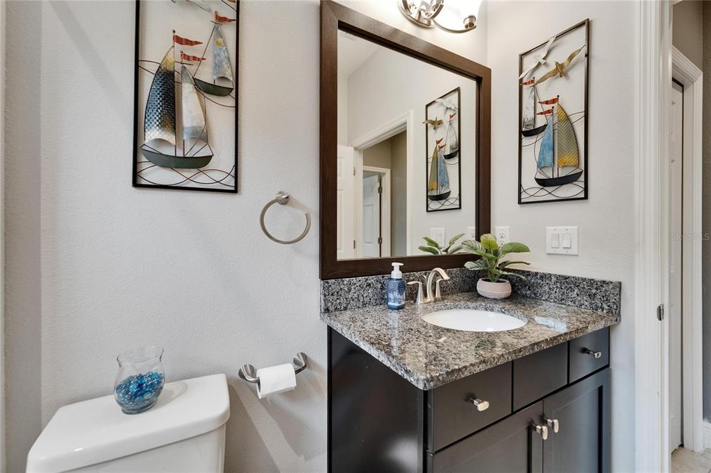 6127 Colmar Place Apollo Beach, FL 33572 - Photo 20 of 72 a bathroom with a granite countertop sink and a mirror