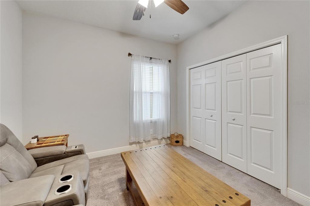 6127 Colmar Place Apollo Beach, FL 33572 - Photo 26 of 72 a bed room with a bed and a couch