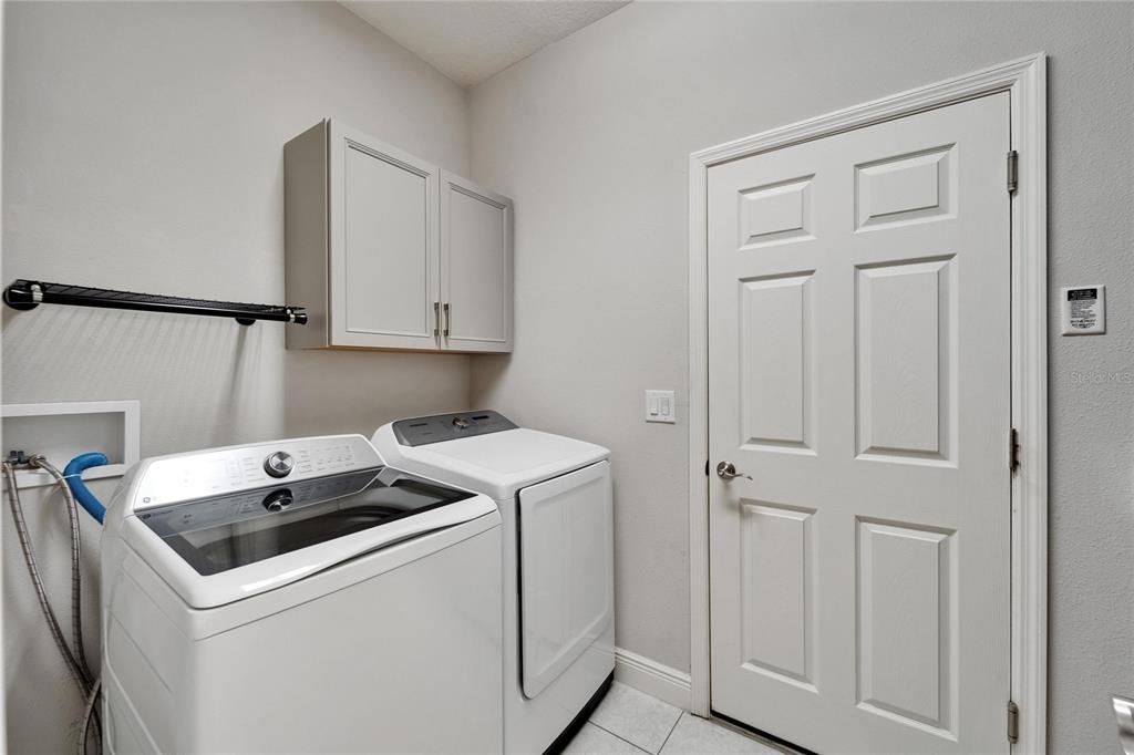 6127 Colmar Place Apollo Beach, FL 33572 - Photo 27 of 72 a utility room with dryer and washer