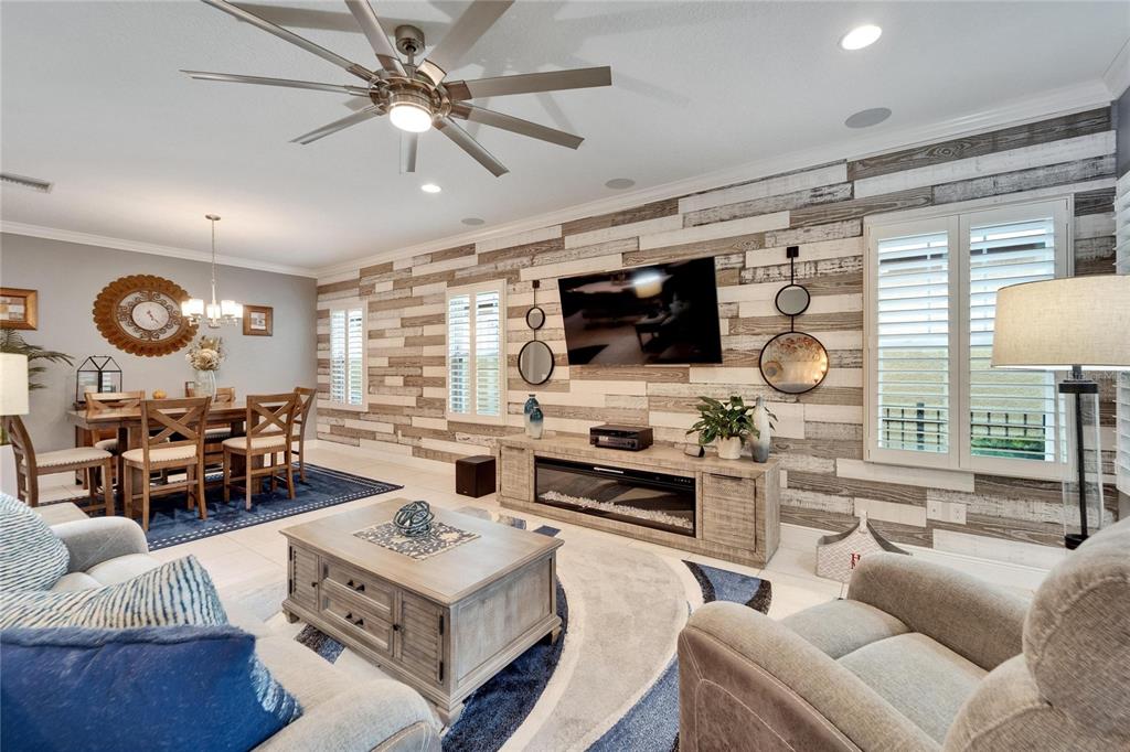 6127 Colmar Place Apollo Beach, FL 33572 - Photo 35 of 72 a living room with furniture kitchen view and a large window