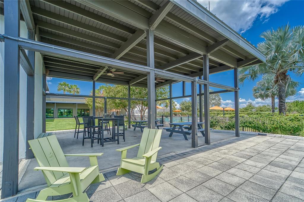 6127 Colmar Place Apollo Beach, FL 33572 - Photo 69 of 72 a view of a patio with a table and chairs