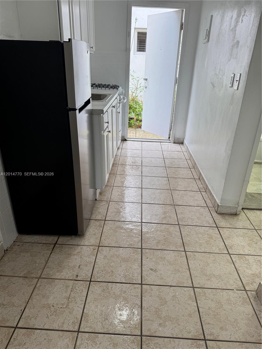 7300 Harding Avenue, Unit 9 Miami Beach, FL 33141 - Photo 1 of 4 a view of a refrigerator in kitchen