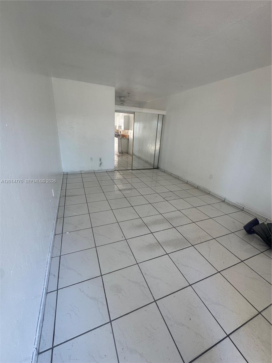 7300 Harding Avenue, Unit 9 Miami Beach, FL 33141 - Photo 3 of 4 a view of an empty room and window