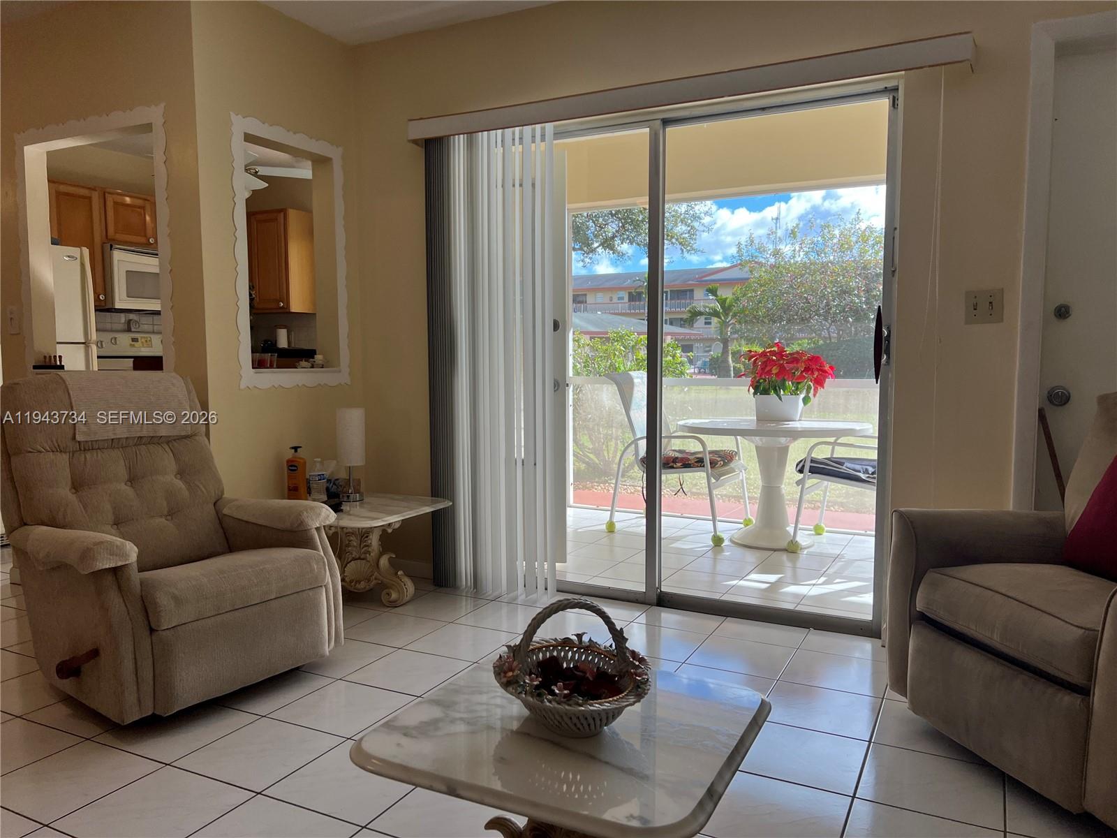 5300 Washington Street, Unit G123 Hollywood, FL 33021 - Photo 4 of 12 a living room with furniture and a potted plant