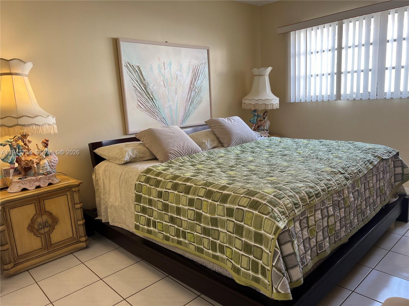 5300 Washington Street, Unit G123 Hollywood, FL 33021 - Photo 5 of 12 a bedroom with a bed and a window