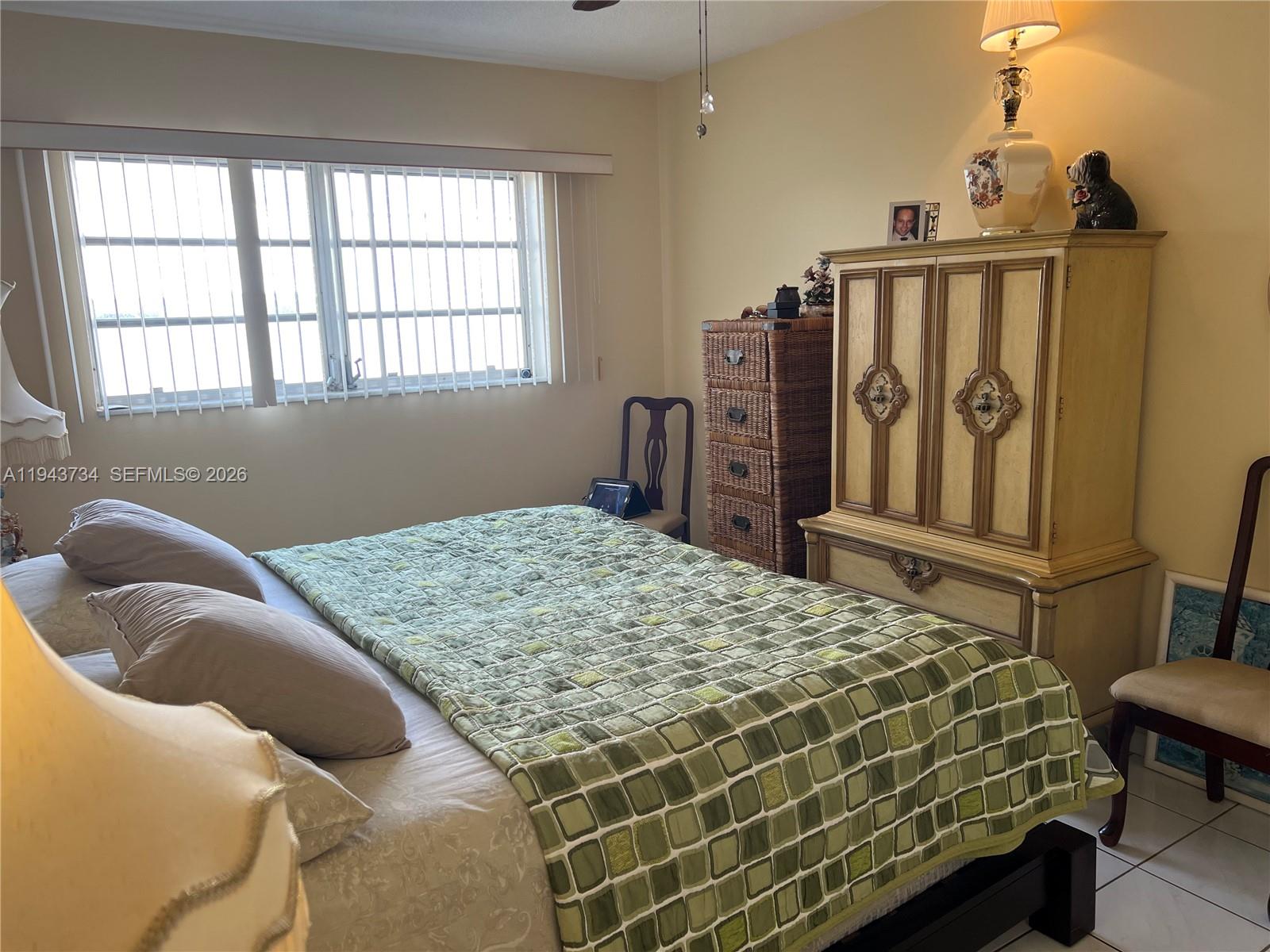 5300 Washington Street, Unit G123 Hollywood, FL 33021 - Photo 6 of 12 a bedroom with a bed and a window