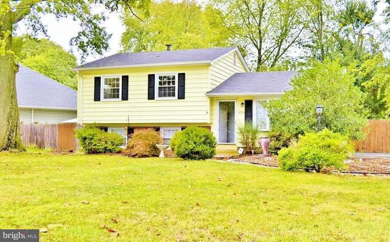 8004 Frye Road Alexandria, VA 22309 - Photo 1 of 21 a front view of a house with a yard