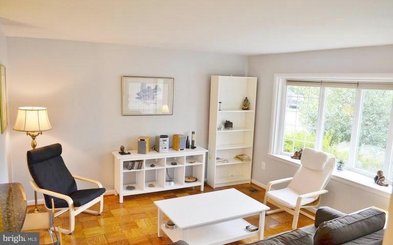8004 Frye Road Alexandria, VA 22309 - Photo 3 of 21 a living room with furniture a piano and a window