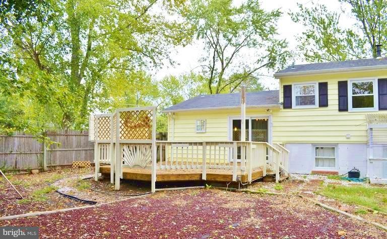 8004 Frye Road Alexandria, VA 22309 - Photo 21 of 21 a view of a house with a yard and wooden fence