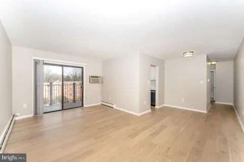 a kitchen with a sink and a stove top oven