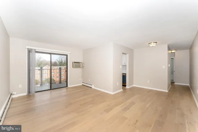 a kitchen with a sink and a stove top oven