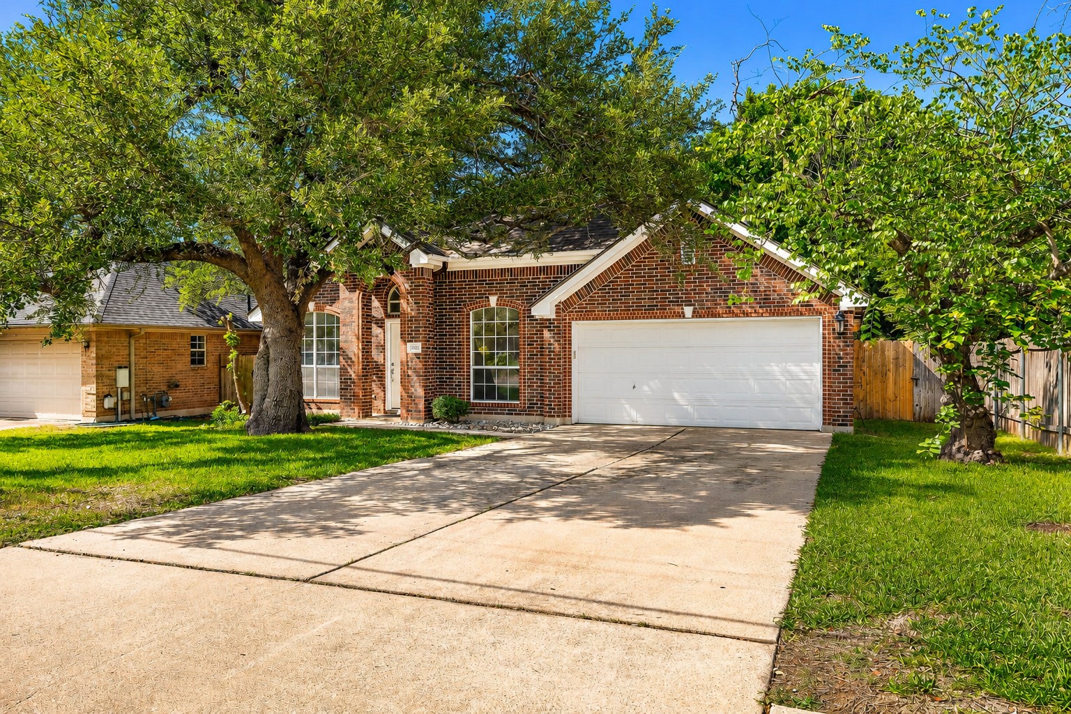 1102 Nelson Ranch Road Cedar Park, TX 78613 - Photo 3 of 37 A classic brick home is complemented by mature trees and a pristine driveway.