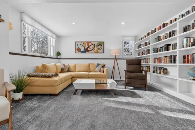 a living room with furniture and white walls