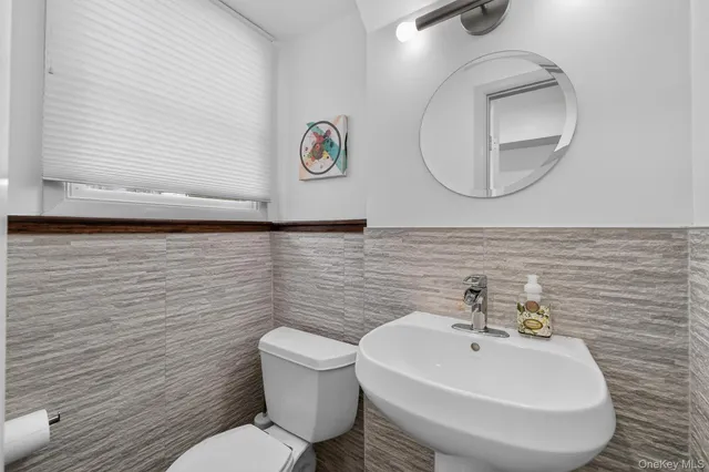 a room with pool table and windows