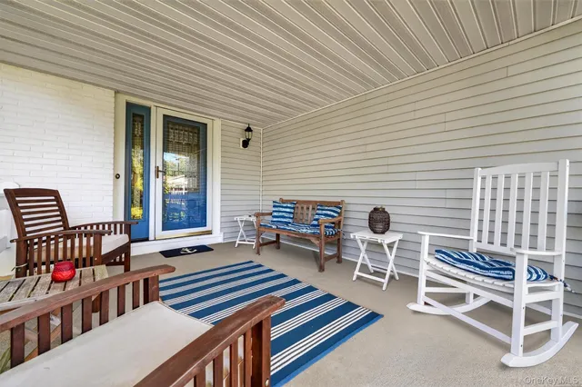 a view of a wooden deck with chairs