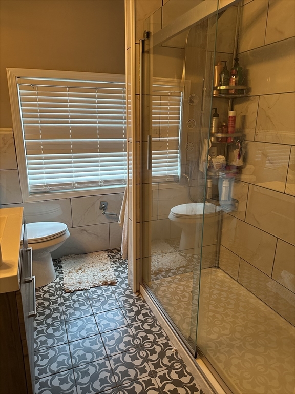52 Warner Street Springfield, MA 01108 - Photo 2 of 8 a bathroom with a toilet and a shower