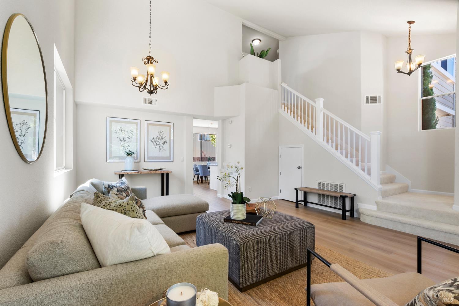 2393 Amethyst Way Santa Rosa, CA 95404 - Photo 1 of 1 a living room with furniture a chandelier and a window