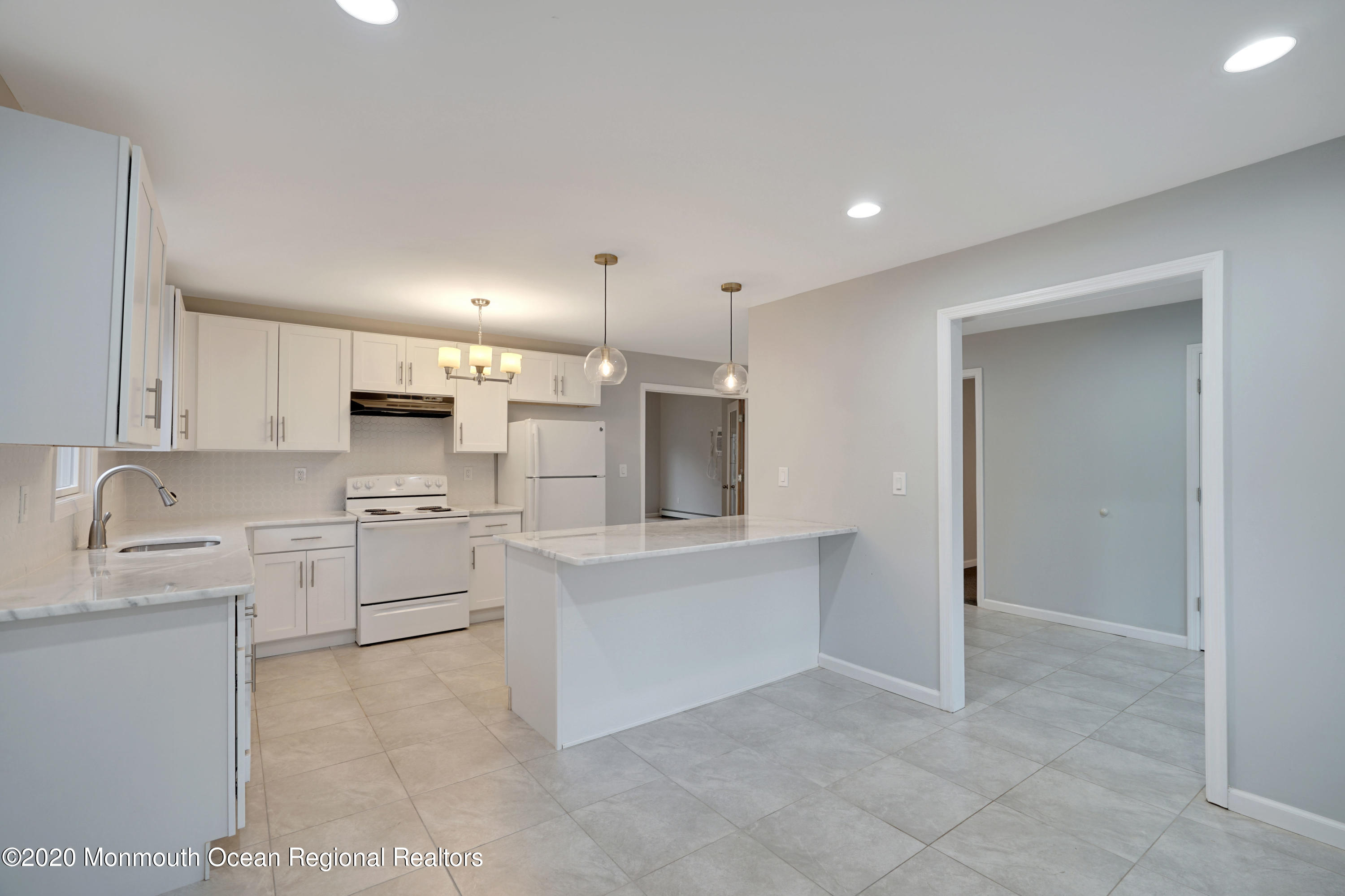 17 Helen Avenue Howell, NJ 07731 - Photo 12 of 67 a kitchen with white cabinets and stainless steel appliances
