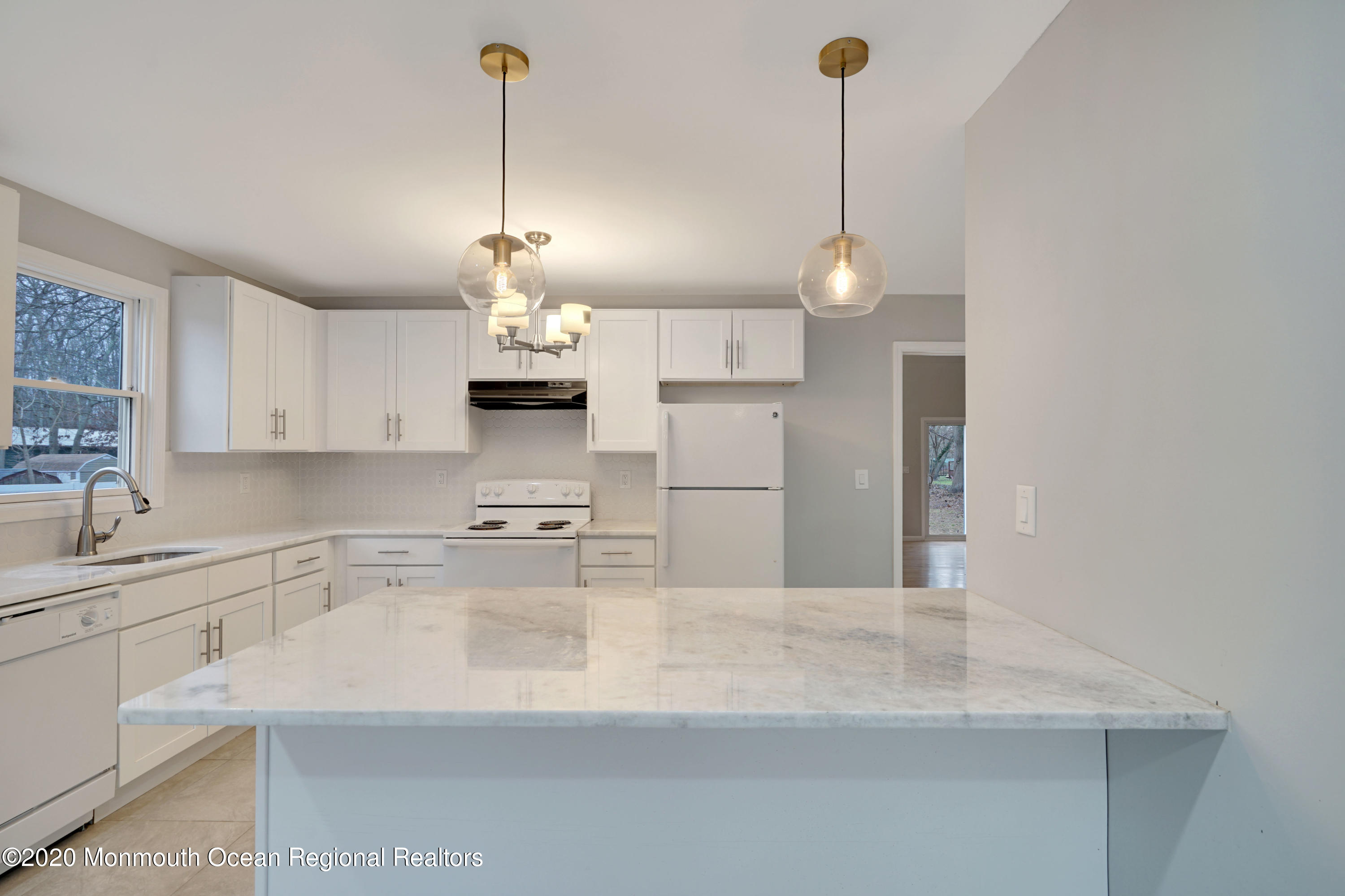 17 Helen Avenue Howell, NJ 07731 - Photo 13 of 67 a kitchen with kitchen island white cabinets and white appliances