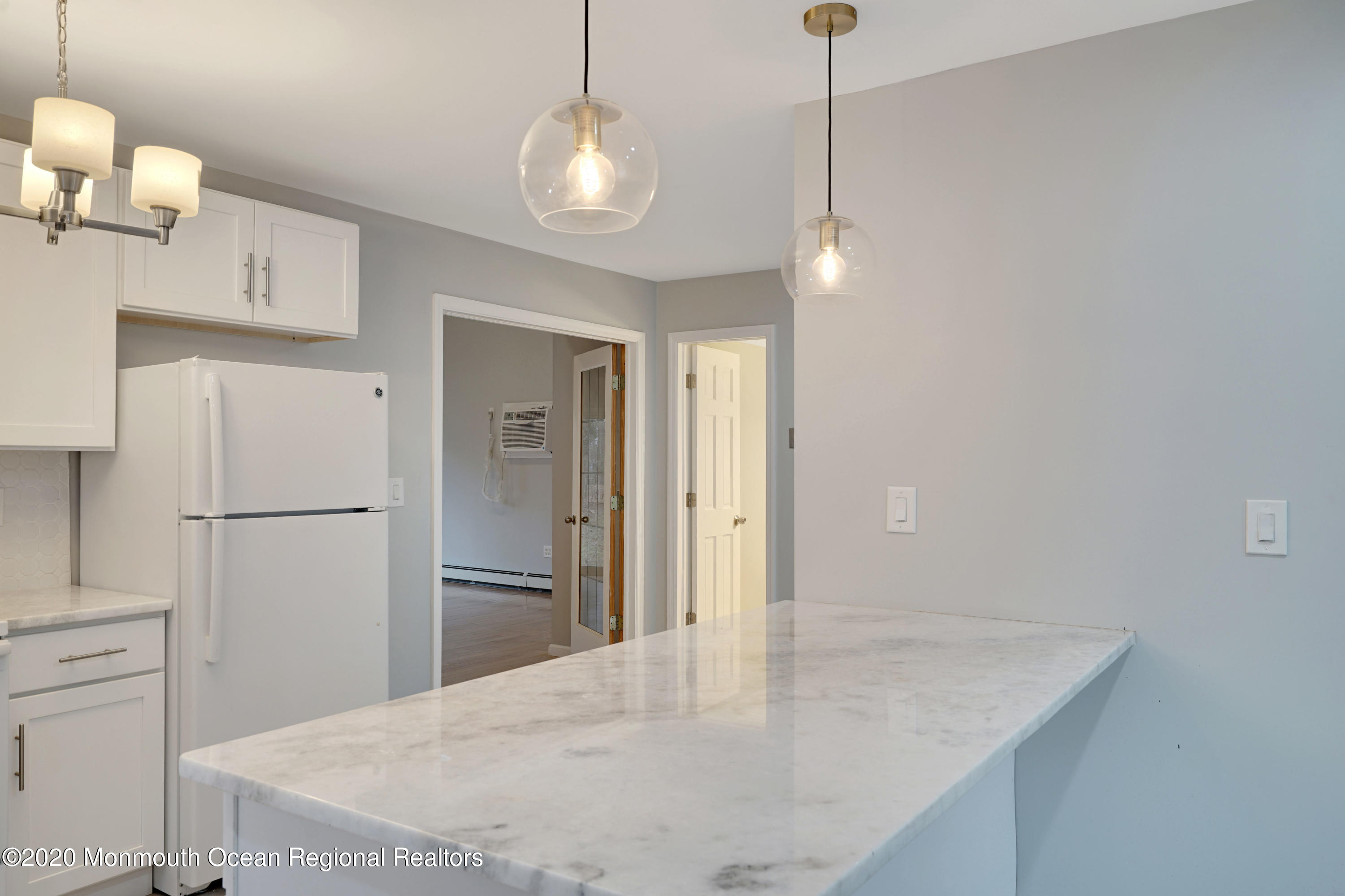 17 Helen Avenue Howell, NJ 07731 - Photo 14 of 67 a kitchen with kitchen island a counter top space cabinets and stainless steel appliances