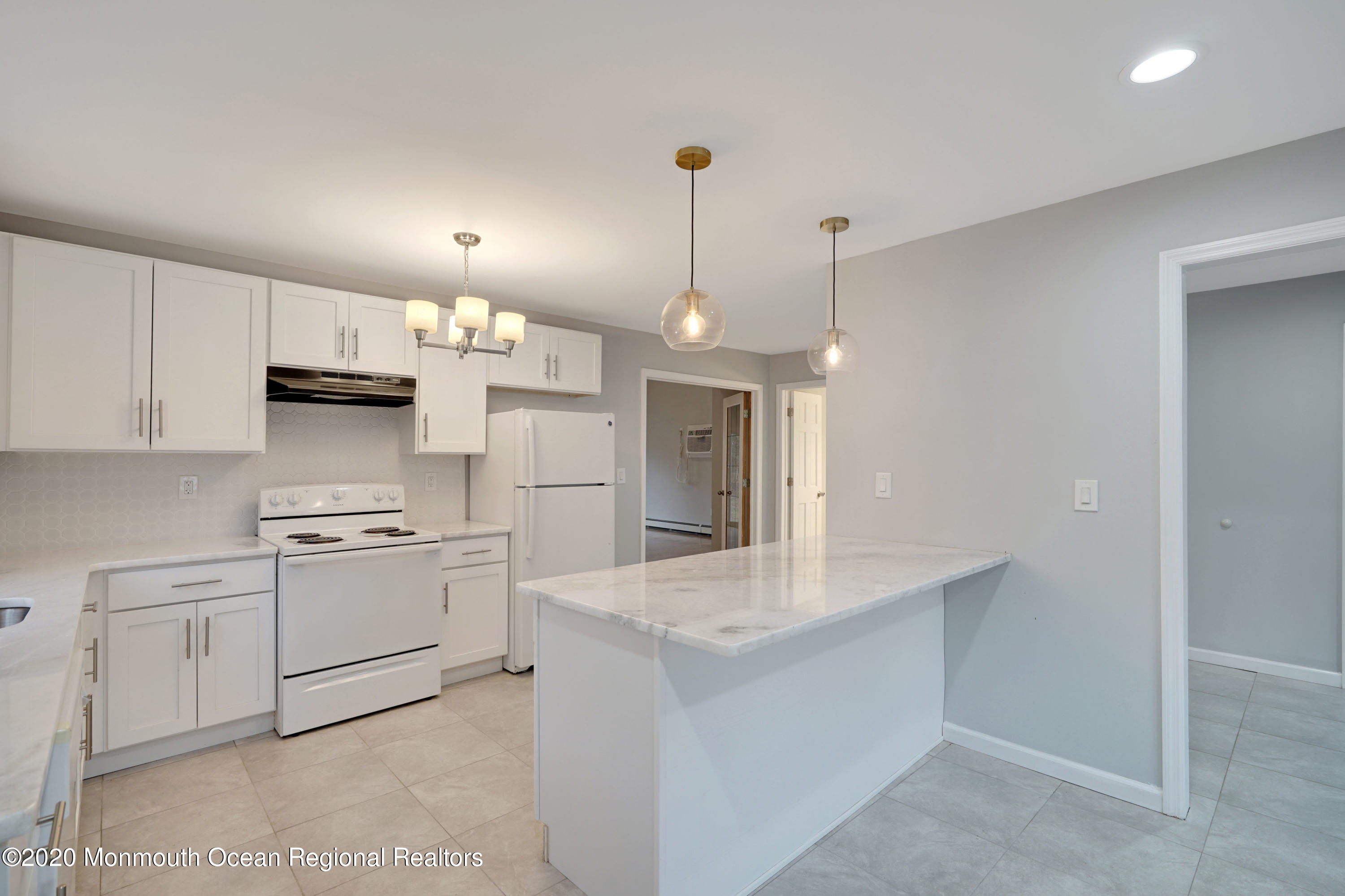 17 Helen Avenue Howell, NJ 07731 - Photo 15 of 67 a kitchen with kitchen island a sink stainless steel appliances and white cabinets