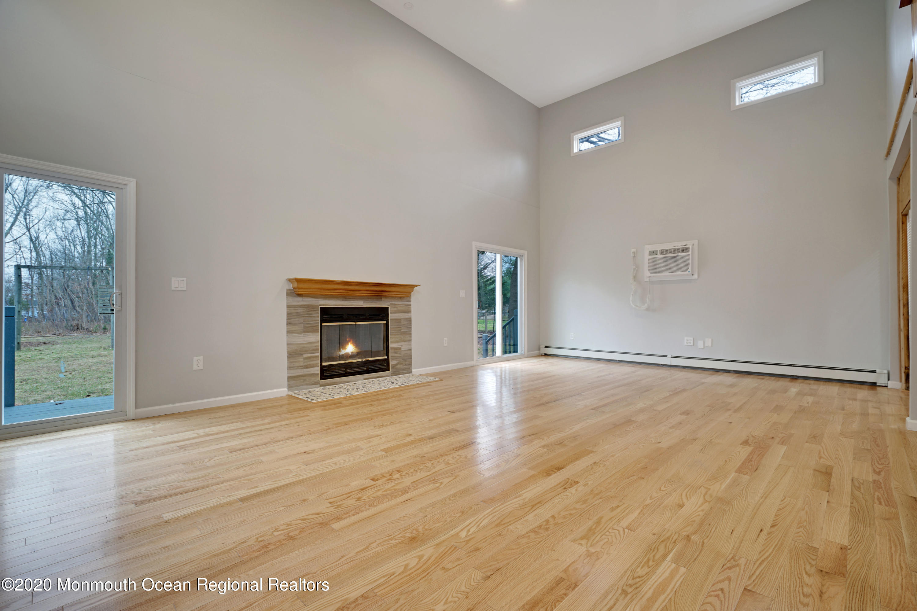 17 Helen Avenue Howell, NJ 07731 - Photo 23 of 67 a view of an empty room with wooden floor and a window