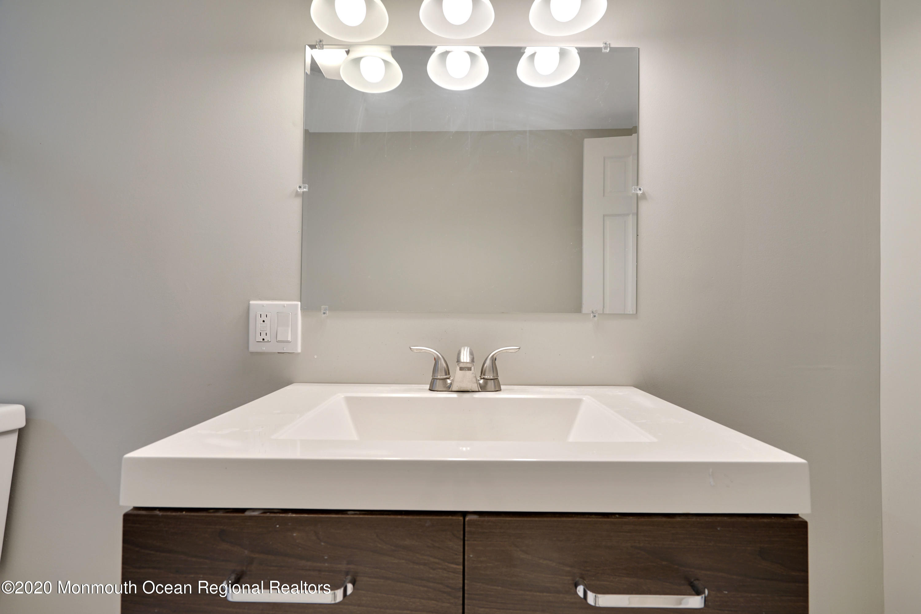 17 Helen Avenue Howell, NJ 07731 - Photo 31 of 67 a bathroom with a sink and a mirror