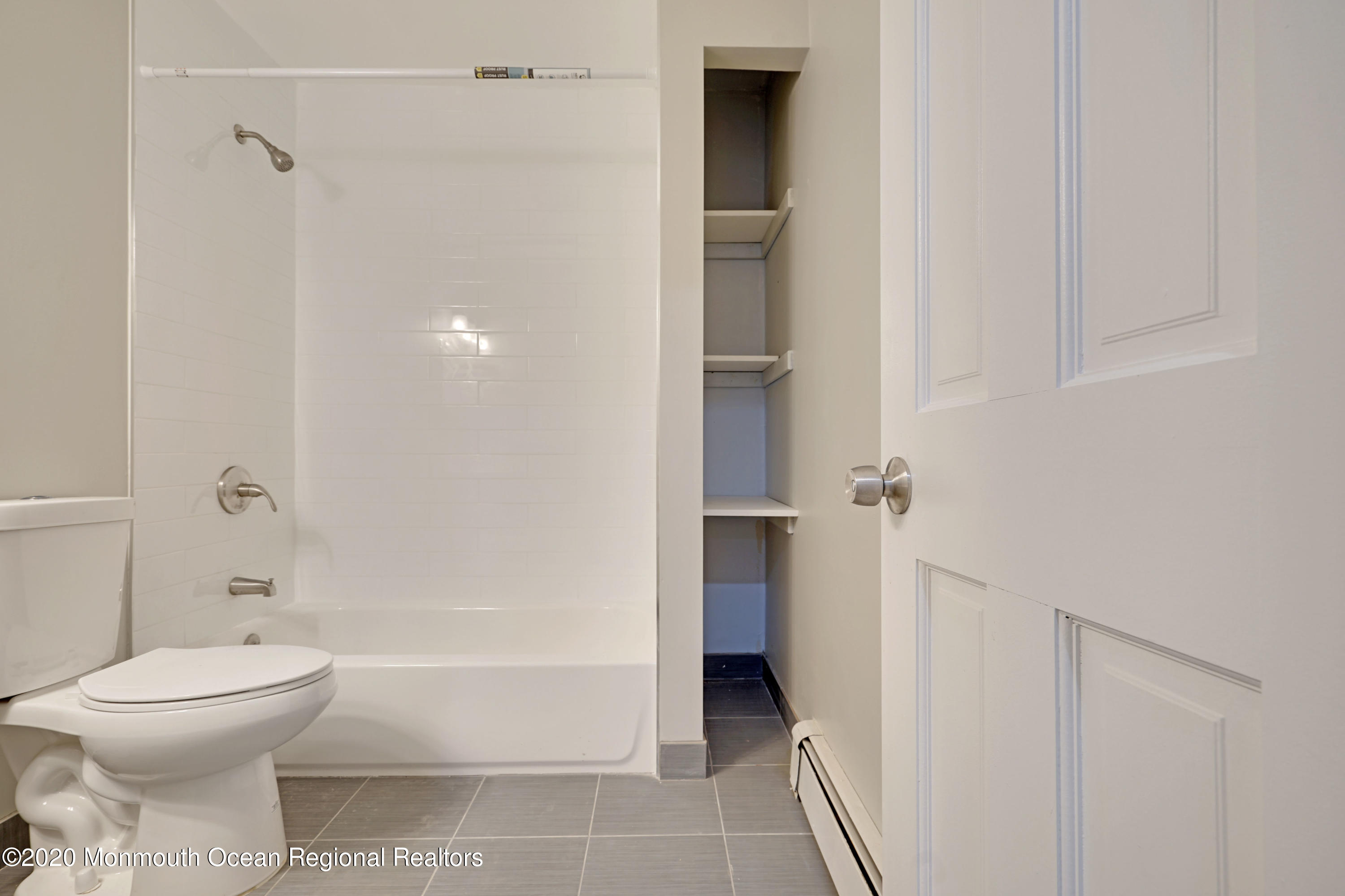 17 Helen Avenue Howell, NJ 07731 - Photo 35 of 67 a bathroom with a toilet and a bathtub