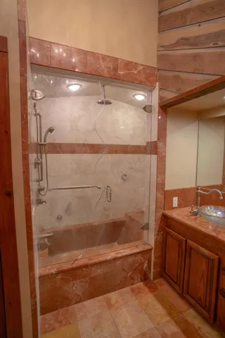 a view of house and front of a tree