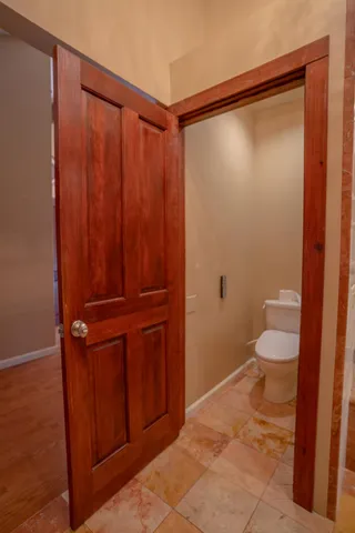 a view of outdoor space with wooden floor and seating space