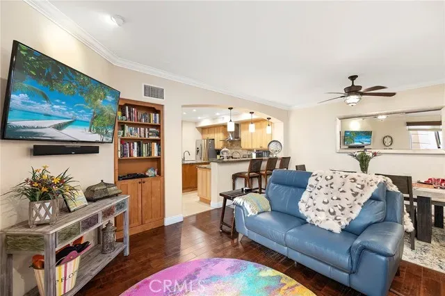a living room with furniture and flat screen tv