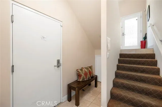 a view of entryway with stairs and furniture