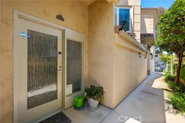 a view of a balcony with wooden floor and potted plants