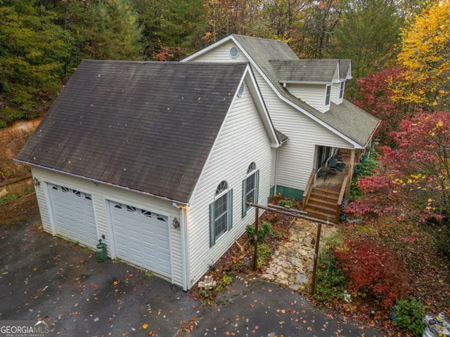 a aerial view of a house with a yard