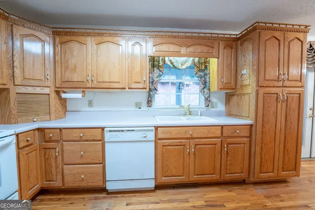 a view of a room with wooden floor and chandelier