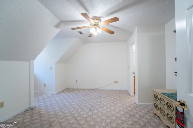 a bathroom with a toilet and a bathtub